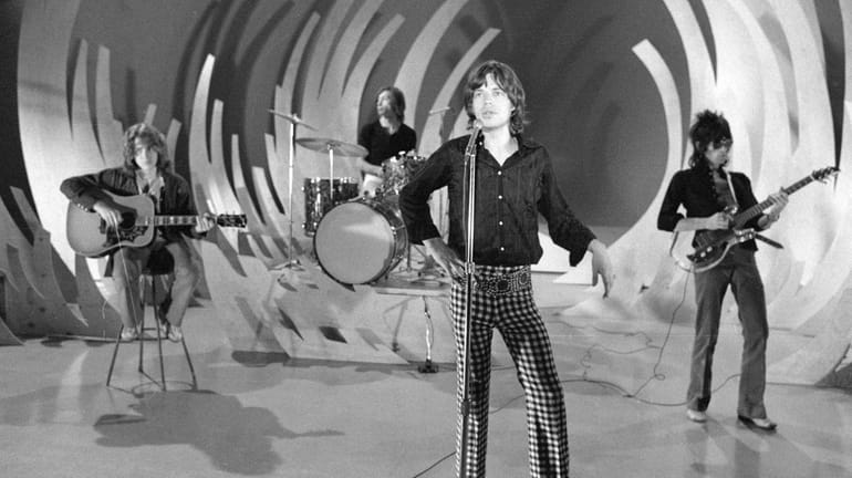 The Rolling Stones rehearse for an appearance on the CBS...
