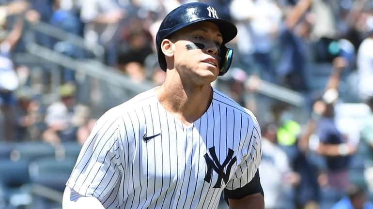 The Yankees' Aaron Judge runs on his two-run home run...