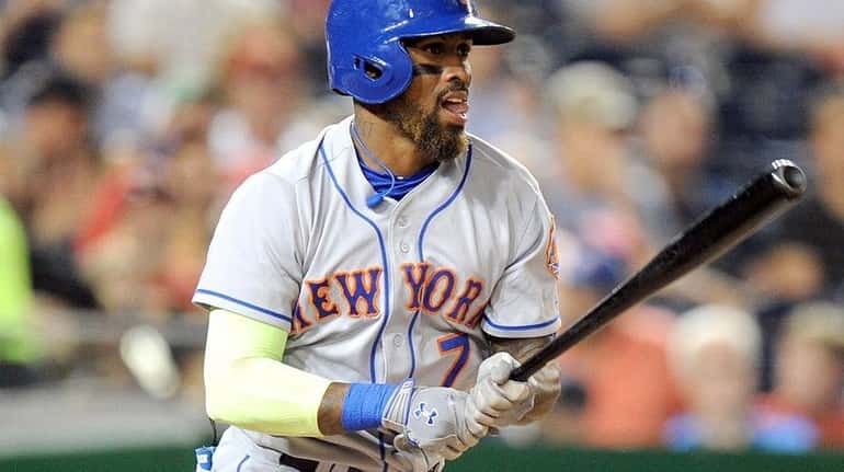 Jose Reyes of the New York Mets hits a single...