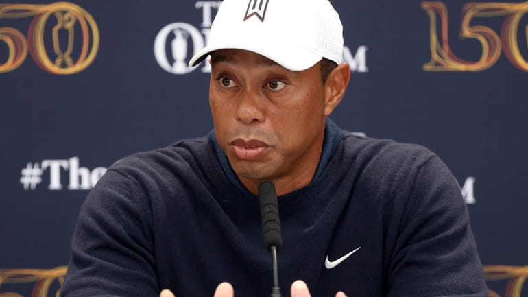 US golfer Tiger Woods speaks during a press conference at...