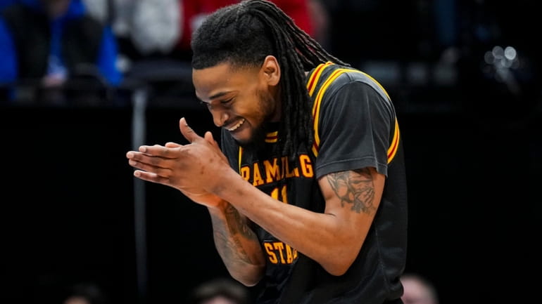 Grambling State guard Jourdan Smith claps during a stop in...