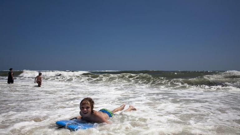 Daniel Seaback rides a wave in on his boogie board...