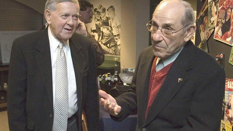 Yogi Berra, right, and broadcaster Bob Wolff talk before viewing...