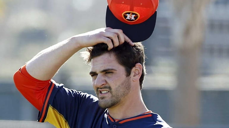 Houston Astros pitcher Nick Tropeano pauses during a spring training...