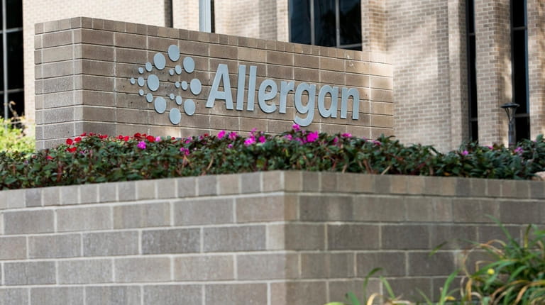 A logo sign outside of the headquarters of Allergan in...