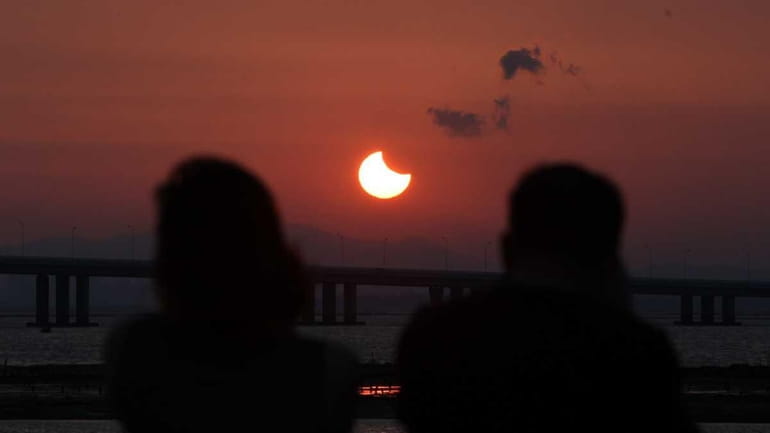 A partial annular solar eclipse is seen from the coast...