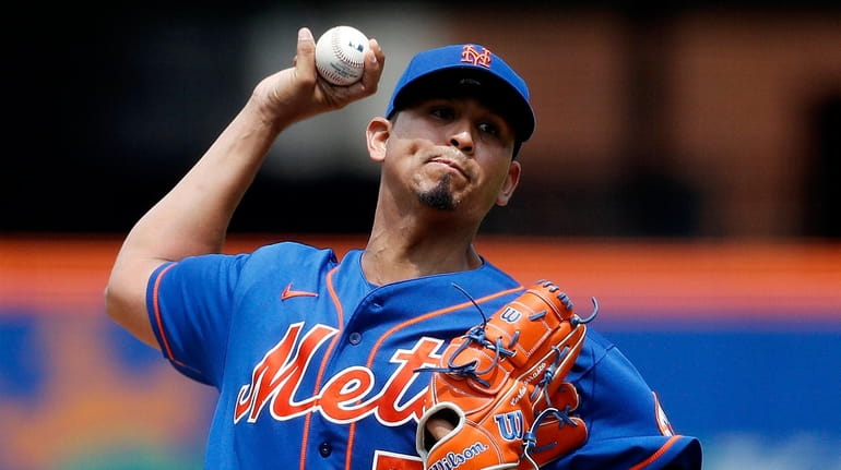 Carlos Carrasco of the Mets throws from the mound before the first...