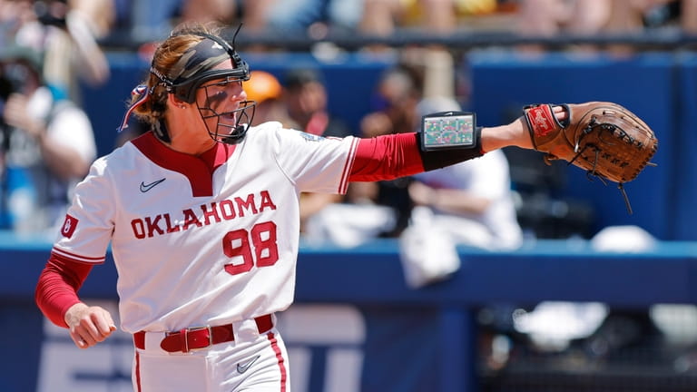 Oklahoma pitcher Jordyn Bahl celebrates after a strikeout against Tennessee...