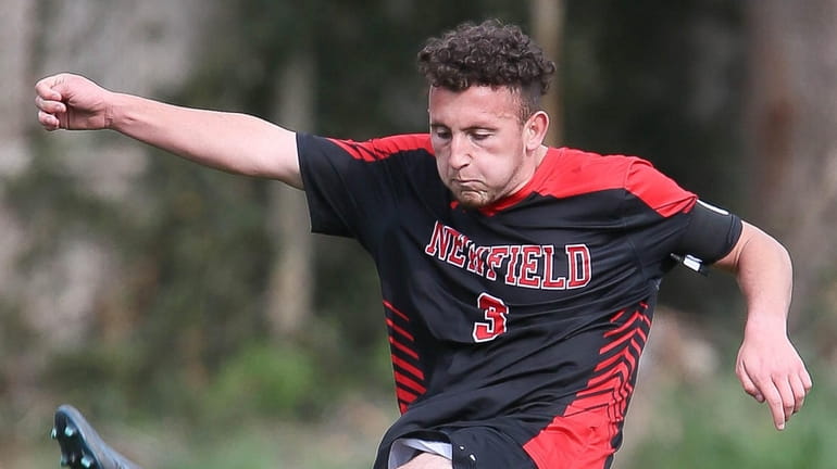 Newfield's Lorenzo Selini takes a shot in the first half during...