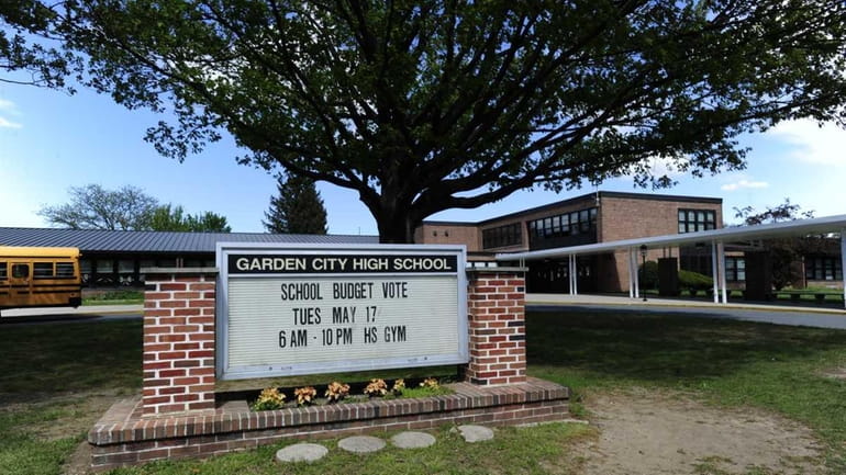 A sign at Garden City High School advertises a school...