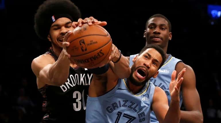 Garrett Temple, foreground, right, shown here against the Nets on...