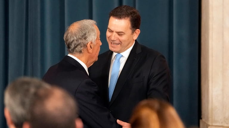 Prime Minister Luis Montenegro is greeted by Portuguese President Marcelo...