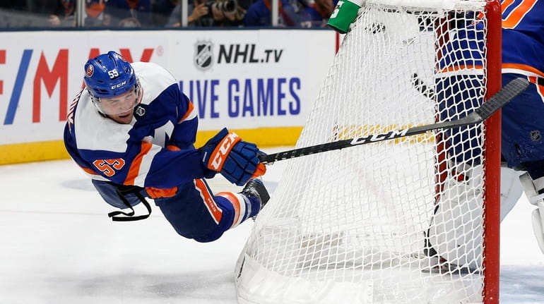 Johnny Boychuk of the New York Islanders clears the puck...