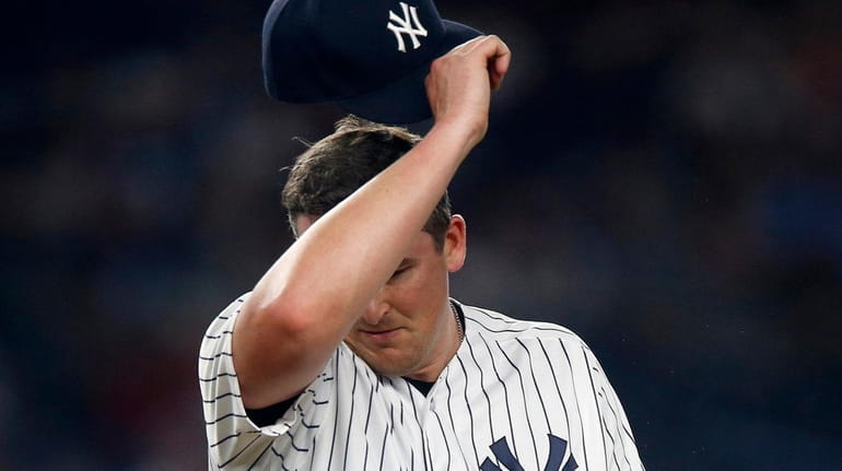 Yankees pitcher Jonathan Holder reacts on the mound during the eighth...