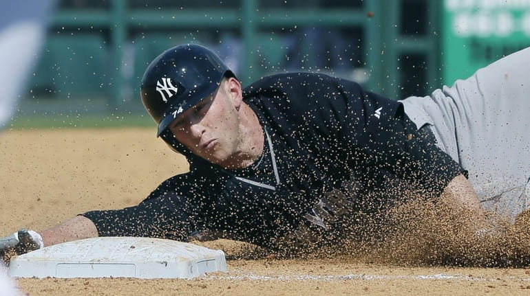 Slade Heathcott safely slides into third on a triple to...
