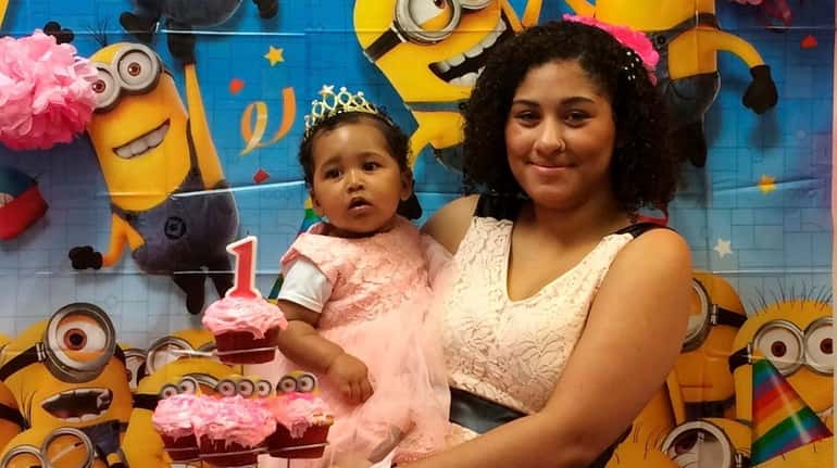 Kimberly Alcequiez and her daughter, Kaitlyn, at her first birthday...