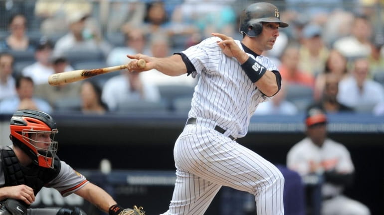 New York Yankees designated hitter Jorge Posada (20) hits a...