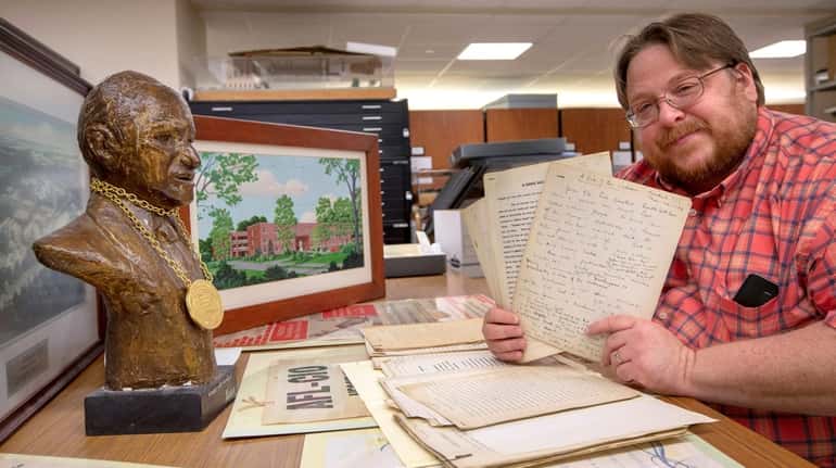 Adelphi University archivist David Ranzan shows items from now-closed Dowling...