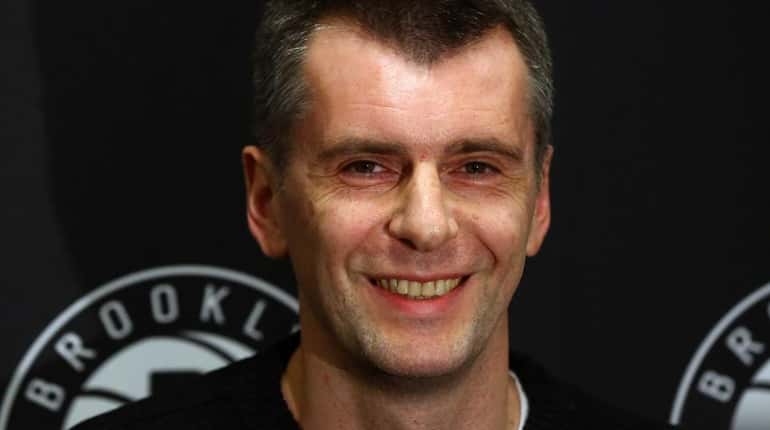 Brooklyn Nets owner Mikhail Prokhorov speaks to reporters at halftime...