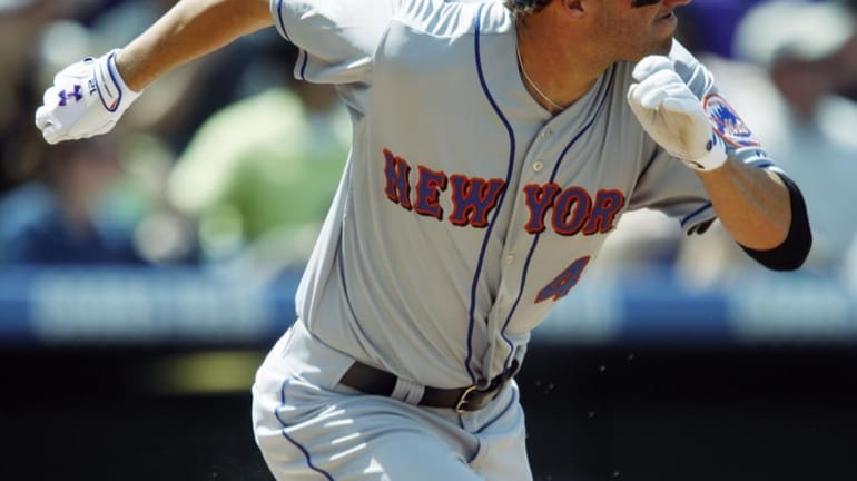 New York Mets' Jeff Francoeur breaks from the batter's box...