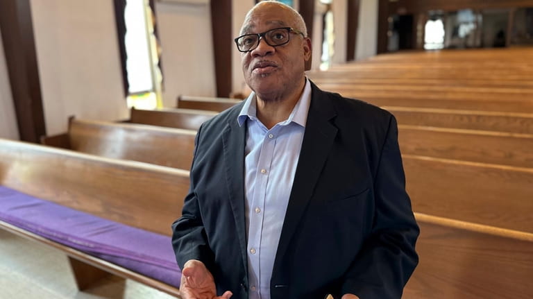 Bishop Hurley Coleman Jr. stands in his church on Tuesday,...