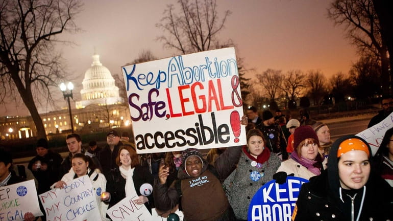 Pro-choice activists with the National Organization For Women hold a...