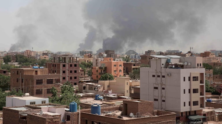 Smoke is seen rising from Khartoum's skyline on Sunday in...