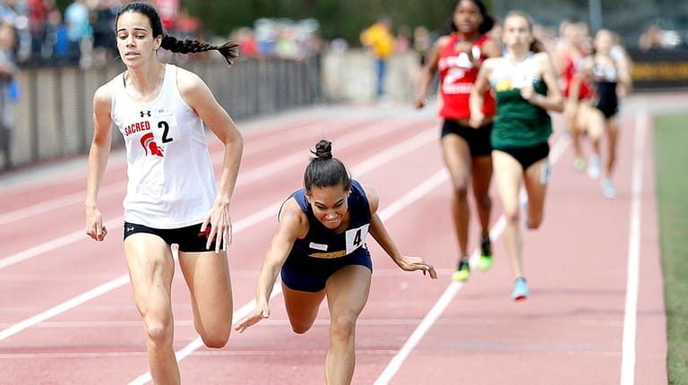 Sacred Heart's Ellen Byrnes continues to the finish line as...