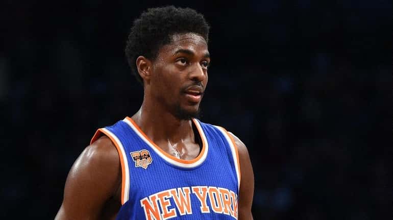 New York Knicks guard Justin Holiday looks on against the...