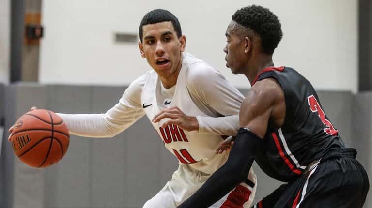 Andre Curbelo of Long Island Lutheran works the ball around...