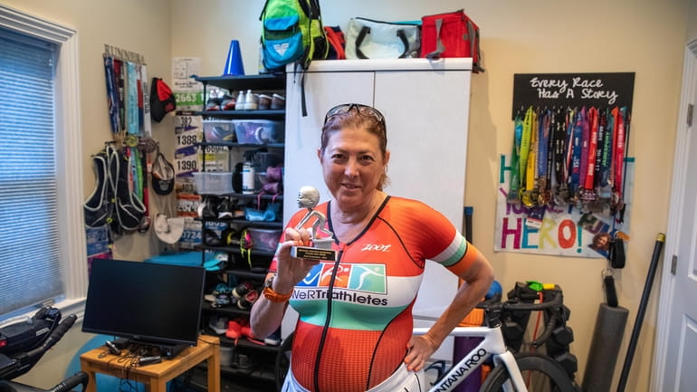 Hilary Topper, 60, displays the “Best Endurance” trophy she won last...