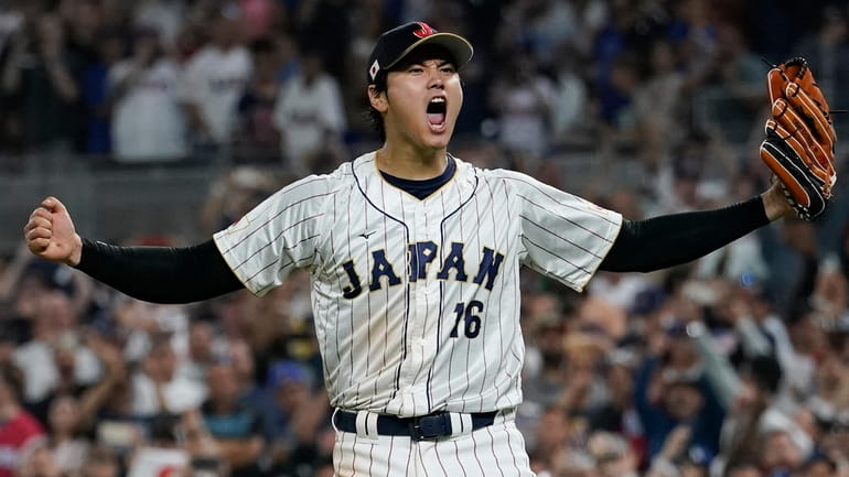 Japan pitcher Shohei Ohtani celebrates after defeating the U.S in the...