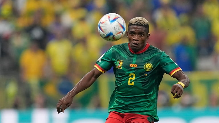 Cameroon's Jerome Ngom Mbekeli controls a ball during the World...