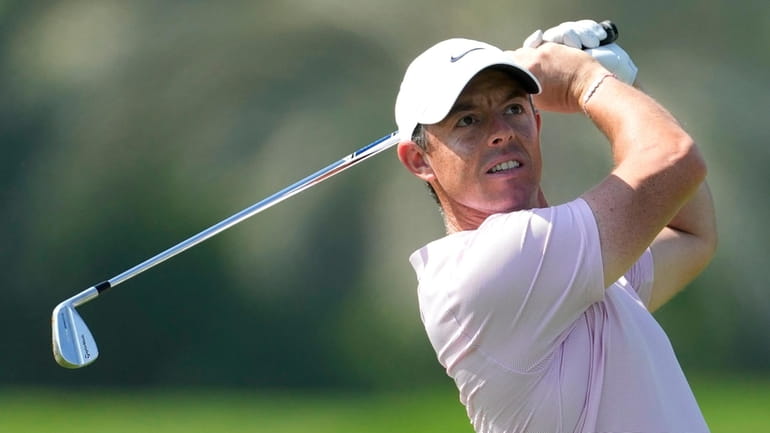 Rory McIlroy of Northern Ireland plays his second shot on...