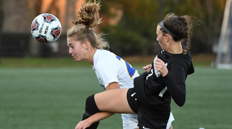Hofstra midfielder Georgia Brown tangles up with Providence's Chloe Ortolano during...