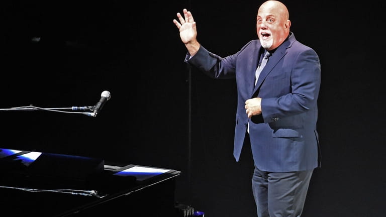 Billy Joel performs before a sellout crowd at the Nassau...