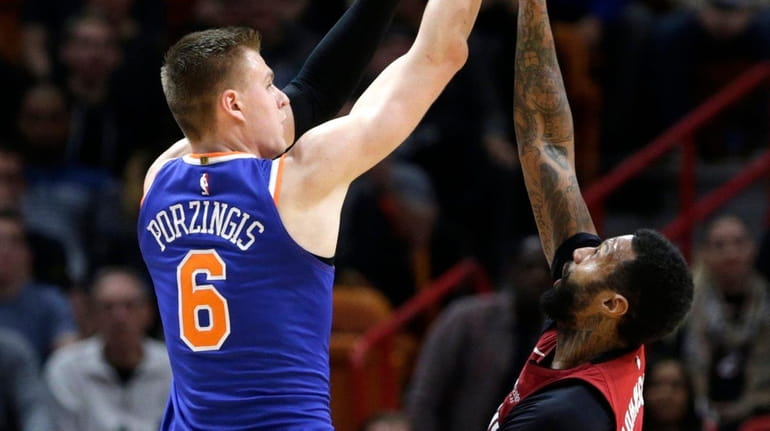 New York Knicks' Kristaps Porzingis shoots as Miami Heat's James...