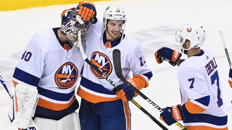 Islanders goaltender Semyon Varlamov celebrates his shutout win and series victory...