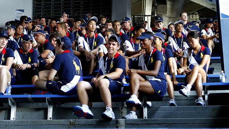 Ball girls and boys wait for the beginning of their...