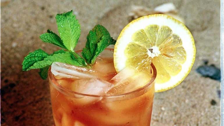 Iced tea with mint and lemon is refreshing on a...