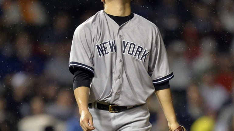 Starting pitcher Masahiro Tanaka of the Yankees stands on the...