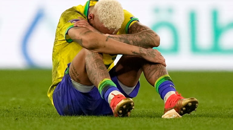 Brazil's Neymar reacts after the penalty shootout at the World...