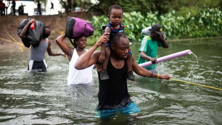 Haitian migrants cross the Rio Grande River in September. 