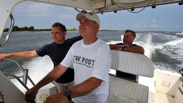The Nowakowski men ply the waters off Long Island in...