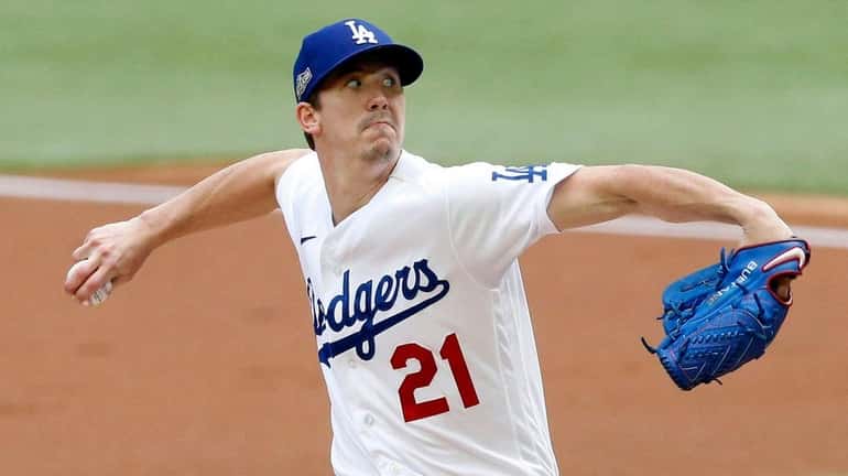 Dodgers starting pitcher Walker Buehler throws against Atlanta during the first...