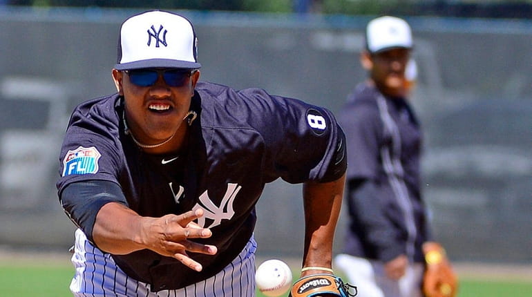 Yankees second baseman Starlin Castro drills during spring training at...