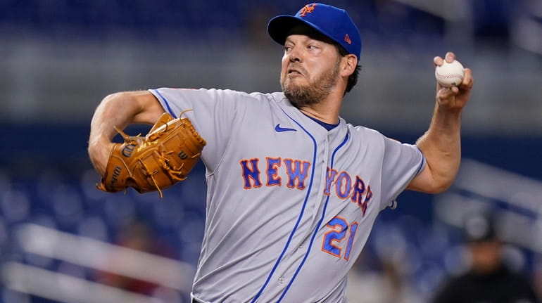 New York Mets' Rich Hill delivers a pitch during the...