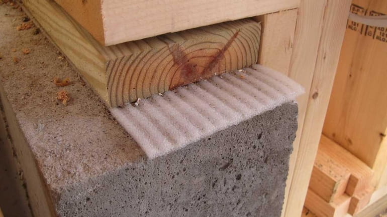 That funny ribbed foam between the wood and the poured...