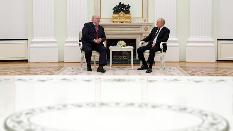 Russian President Vladimir Putin, right, and Belarus President Alexander Lukashenko...
