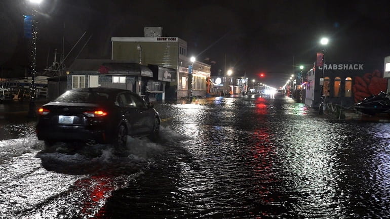 With high tide approaching, Woodcleft Avenue in Freeport starts to see...